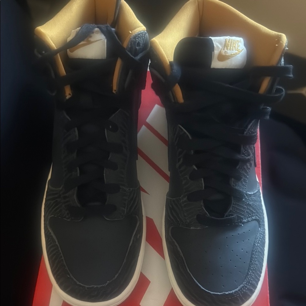 Nike Black and Gold Sneakers with Modern Design